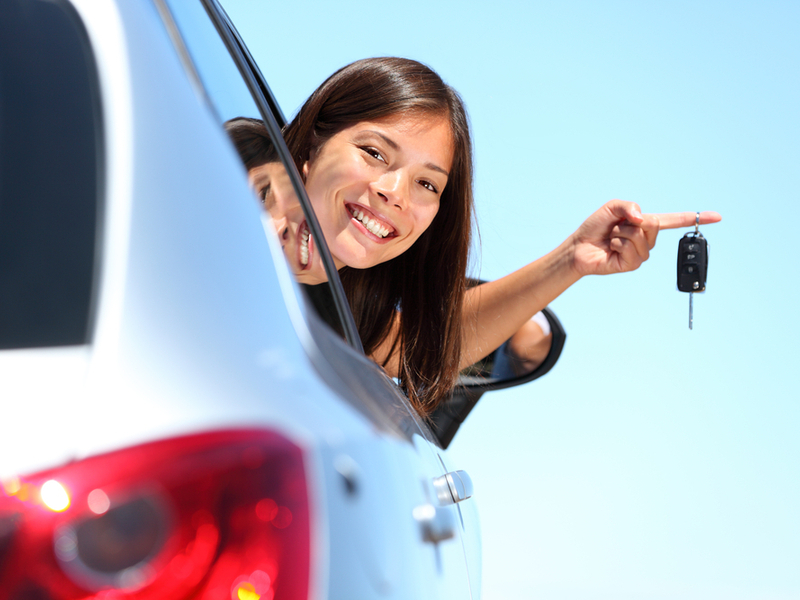woman holding car keys