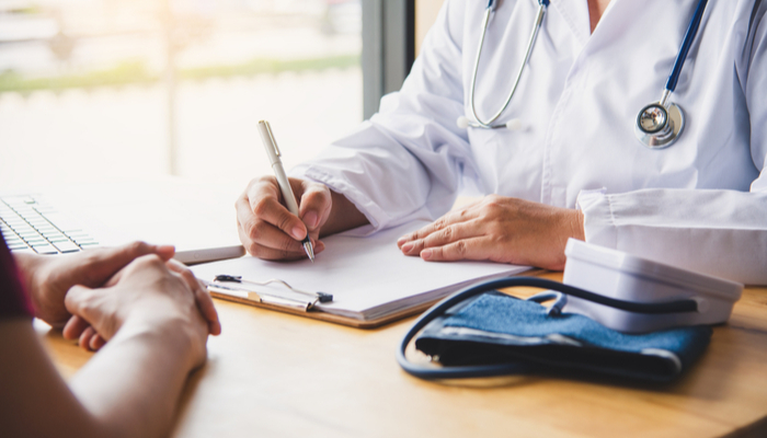 doctor examining patient