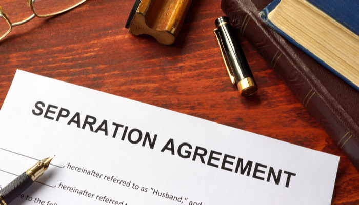 Separation agreement document with black fountain pen on an office table